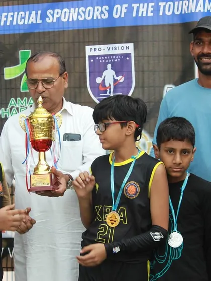 Receiving the trophy with the Under-12 team. I always say, winning is a habit, not a fluke, and these kids are learning that early.
