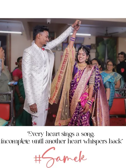 A moment of pure celebration. The groom raises the bride's hand in the air after the ring exchange, a joyful and triumphant photo that captures the energy of the room.