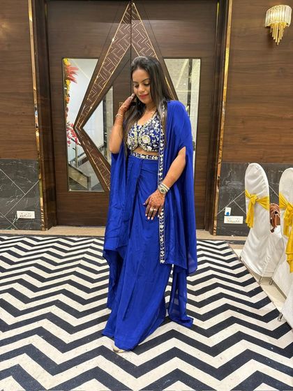 Another shot of the client confidently rocking the royal blue cape set.