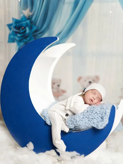 Sleeping on the moon. This is one of our favorite poses for newborns, creating a dreamy and magical portrait. This entire setup was done in our client's home.