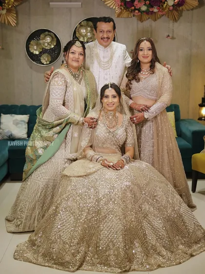 A formal version of the wedding family portrait, with everyone looking at the camera, creating a timeless keepsake.