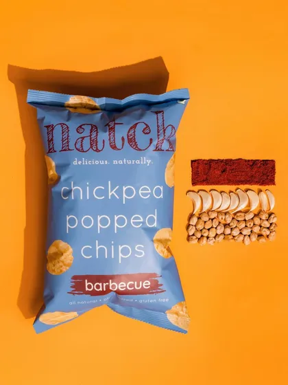 A bold and punchy shot for Natch barbecue chips. The hard shadow and deconstructed ingredients create a modern and impactful product visual.