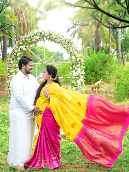 A romantic couple's portrait in our garden, with the mother-to-be's yellow and pink saree flowing in the breeze.
