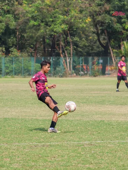 A player demonstrates excellent ball control during a TYL match, preparing to make the next move.