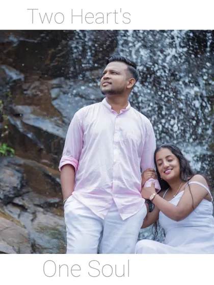 "Two Hearts, One Soul." A serene portrait of the couple against a stunning waterfall backdrop, perfect for a romantic and adventurous pre-wedding album.
