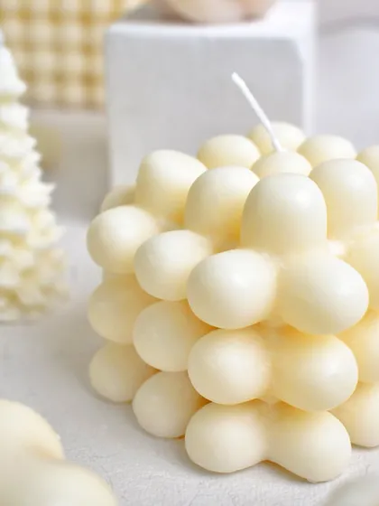 A close-up of our flower-shaped bubble candle. A unique and beautiful addition to our Christmas collection.