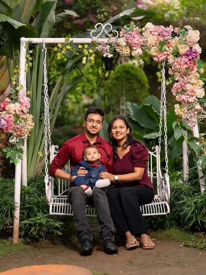 Creating a classic family portrait is about more than just posing. It's about finding a beautiful setting, like this floral swing, and creating a relaxed atmosphere where the family's natural connection can be felt. This is a timeless heirloom photo the family will cherish for years.