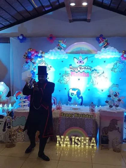 Performing the paper stream trick at a 'My Little Pony' themed birthday party. The stage is set for a truly magical experience.
