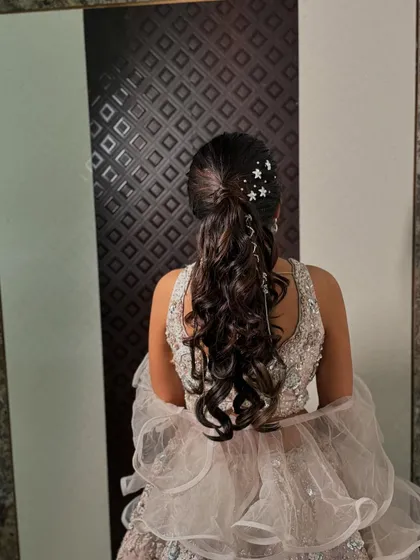 A full view of the sangeet hairstyle, which is both practical for dancing and incredibly stylish.