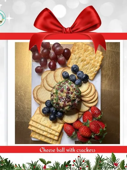 A festive favorite, my cheese ball with crackers, presented as the perfect holiday gift. It's a creamy, savory centerpiece for any Christmas gathering, surrounded by fresh berries and grapes.