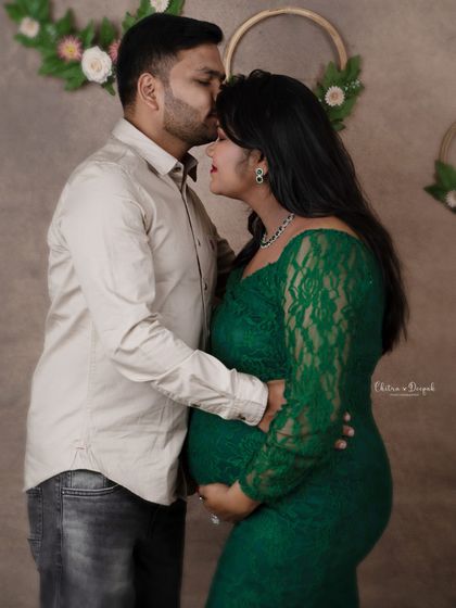 A sweet and intimate moment. The partner's gentle kiss on her forehead shows so much love and affection.