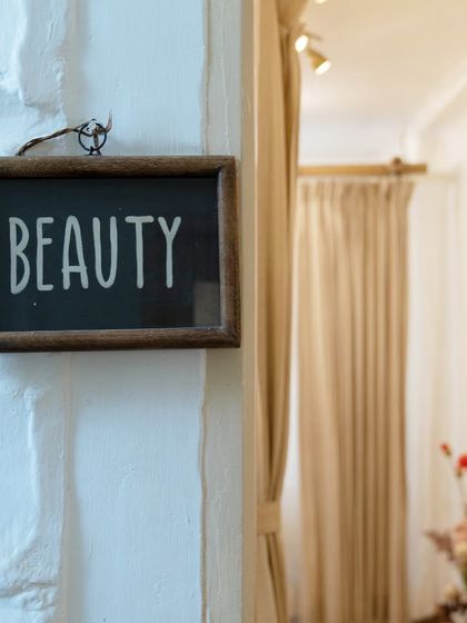 A close-up of the "Beauty" sign that marks the entrance to my treatment area. It's a simple reminder of the self-care journey you are about to begin.