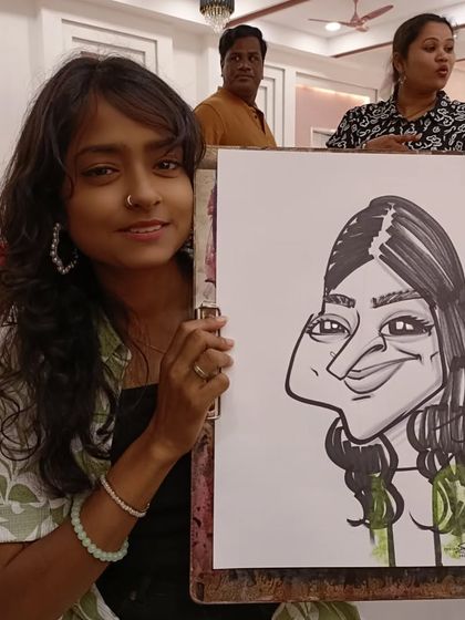 A young teacher with her caricature. It's a fun memento from a day with colleagues.