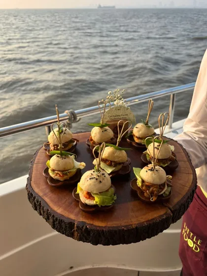 Your celebration, your location. We bring the complete gourmet experience wherever you are, even sailing into the sunset on a yacht. This event featured custom bite-sized sliders, perfect for enjoying the sea breeze and stunning Mumbai views.