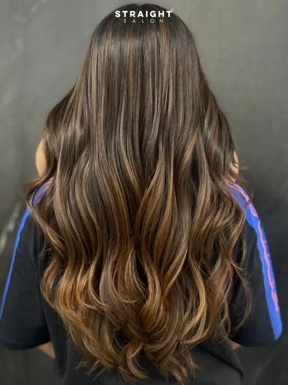 Walking into the sunlight with my balayage hair. The light catches the warm tones perfectly.