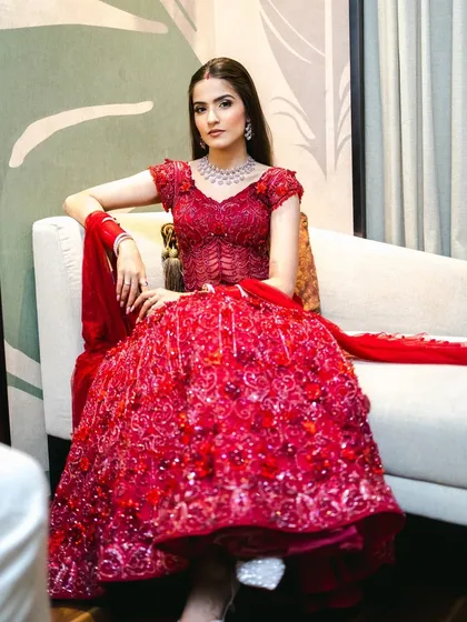 The full view of this breathtaking red reception gown. My goal was to create a makeup look that was as glamorous and show-stopping as her outfit.