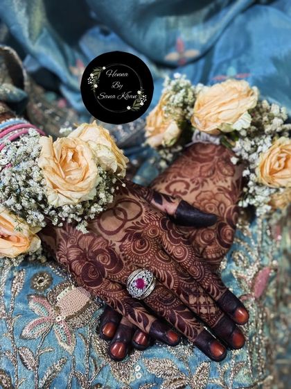 A close-up of the rich henna stain, showing a personalized ring design. The color is a testament to the quality of my organic henna.