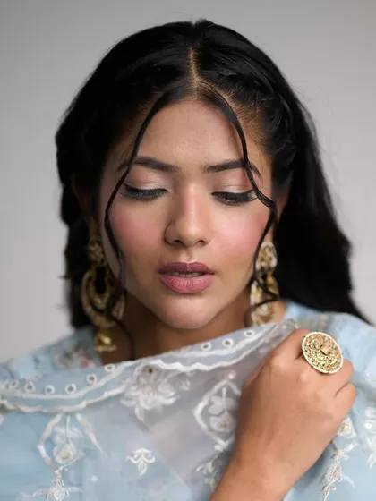Another beautiful shot highlighting the delicate details of the makeup, including the soft blush and natural lip color.