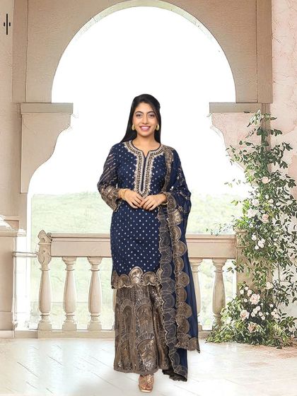 A classic navy blue and gold sharara set. This is a timeless and elegant choice that you can rent for a wedding reception or a formal festive dinner.