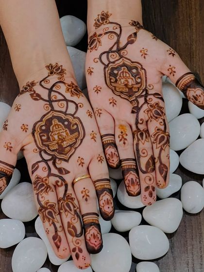 A delicate and whimsical design with a central temple motif, surrounded by flowing floral vines. The use of open space keeps it feeling light.