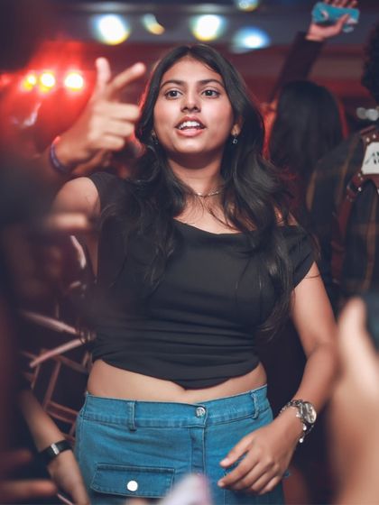 A guest singing along to the music on the dance floor. Playing tracks that everyone knows and loves is key to creating a fun, interactive atmosphere.