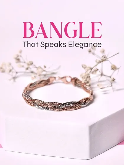Grace your wrists with this timelessly elegant braided bangle, a beautiful blend of rose gold and silver tones.