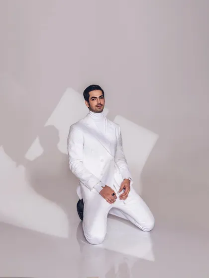 Another angle of the modern white suit, showing the textured fabric and sharp tailoring. This look is an example of my minimalist styling for contemporary menswear.