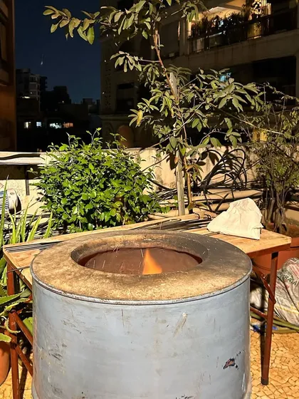 Setting up a live tandoor on a client's terrace in Bandra. I bring all the necessary equipment to create an authentic outdoor cooking experience, perfect for evening parties and gatherings.