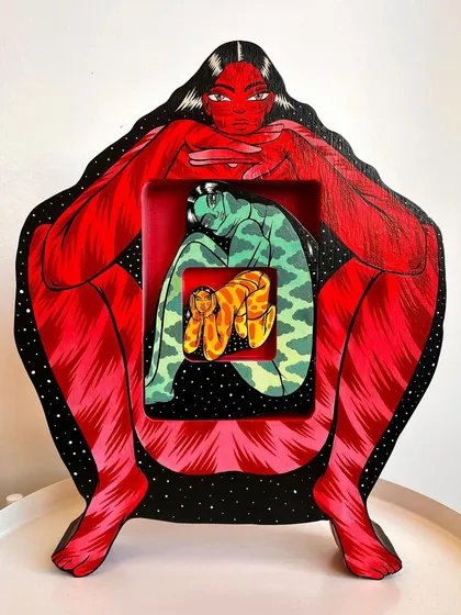'Safe Spaces,' an interactive, illustrated wood sculpture. This piece consists of three nesting figures, like Russian dolls, that represent different versions of the self.