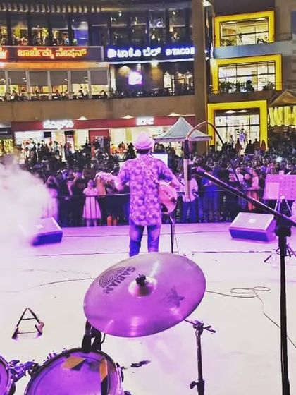 Another perspective of the stage at Phoenix Marketcity, with purple lighting and smoke effects creating a dramatic and immersive concert atmosphere.