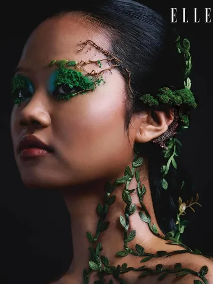 Another portrait from the Elle India series, showcasing the complete look with dramatic lighting. The dark background makes the green elements and the model's features stand out.