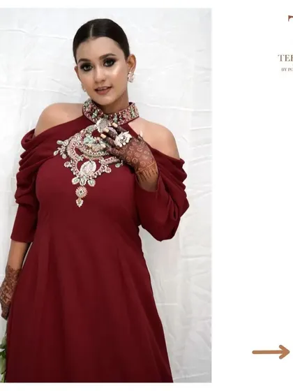 Another view of our stunning maroon gown, perfect for making a grand entrance at any event.