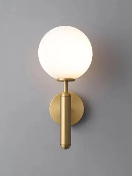 This product shot showcases the warm, even glow produced by the frosted globe sconce. The light is soft and flattering, ideal for creating ambient lighting in living rooms or bedrooms.