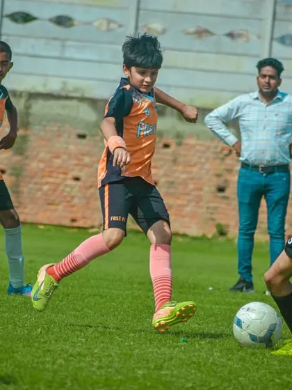 Our player evading a tackle during a U13 Pride Cup match.