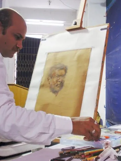 A focused moment during a live portrait demonstration of my respected guru, Shri Vasudevji Kamath. This piece was created using pastels on toned paper, a medium that allows for soft transitions and rich detail.