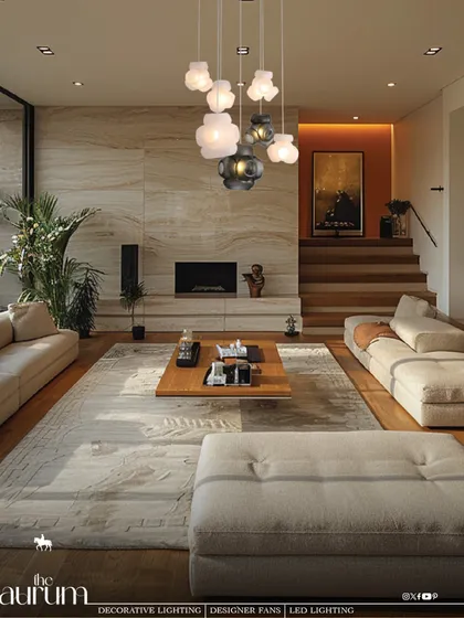 For this living room, I designed a cascading cluster of cloud-like pendant lights to serve as a soft, sculptural centerpiece. The arrangement adds depth and a touch of modern artistry, creating a warm and inviting atmosphere over the main seating area.