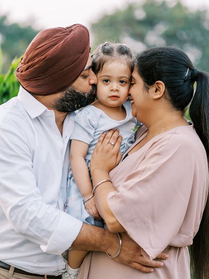 A family sharing a group hug. These moments of affection are the most precious to capture.