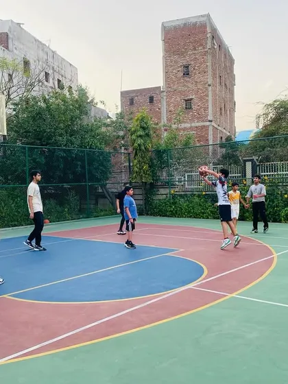 A player looks to make a pass to an open teammate, demonstrating good court vision.