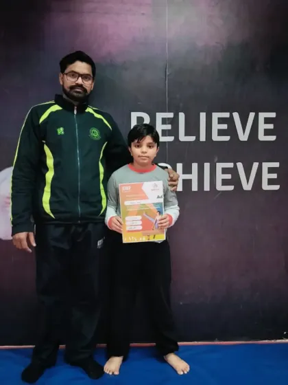 This student has earned a new certificate, marking his progress in our gymnastics program.