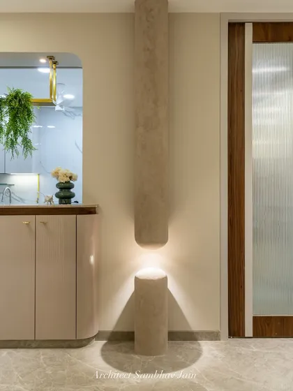 Another view of our sculptural column light, meticulously crafted on site. The interplay of light and shadow adds depth, while the cylindrical volumes echo the home’s soft, modern design language.