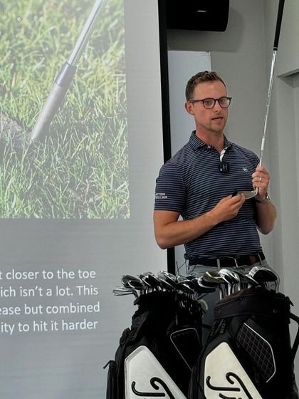 A close-up of an expert explaining the nuances of club design. A deep technical understanding is something I expect from all my coaches.
