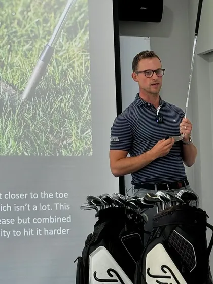 A close-up of an expert explaining the nuances of club design. A deep technical understanding is something I expect from all my coaches.