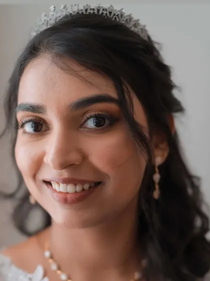 A close-up of Hannah's bridal makeup. The look is soft, romantic, and enhances her beautiful features perfectly.