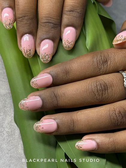 A soft and glamorous design featuring peach nude nails with a dreamy waterfall glitter effect on the tips. This look is perfect for weddings, parties, or a subtle yet fabulous vibe.