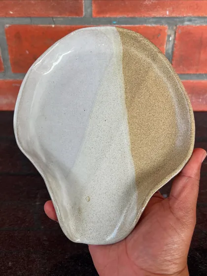 A beautifully formed spoon rest with a simple, two-tone glaze. It's the small, functional pieces that can bring so much joy to a kitchen.