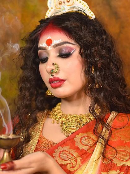 A beautiful shot with a diya, adding a spiritual and traditional element to the concept.