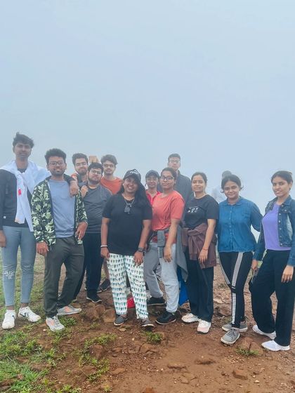 A group photo on a foggy trail.