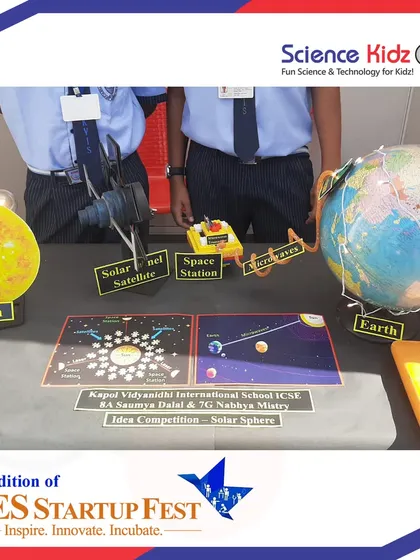 A close-up of the "Solar Sphere" project, which includes models of the sun, earth, a solar panel satellite, and a space station. The project demonstrates a complex system for energy transmission.