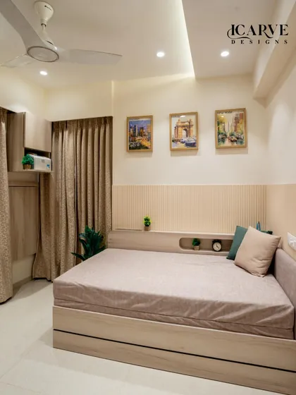 A wider view of the bedroom with the integrated headboard shelf, showing how it provides functionality without taking up floor space.