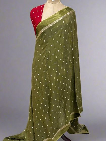 The same beautiful Chinon saree design, this time in a lovely mehndi green. This earthy tone is very versatile and can be dressed up or down for any occasion.